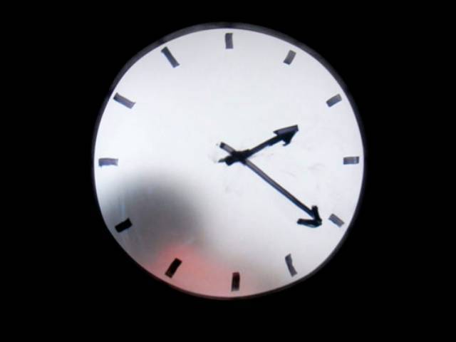 Ok, looks like he's done and disappearing behind the clock