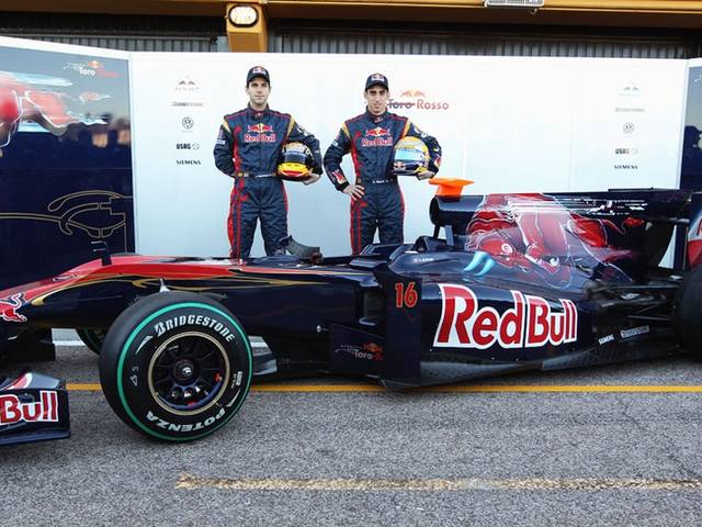 Sebastian Buemi and Jaime Alguersuari pose with the new STR5 from Scuderia Toro Rosso