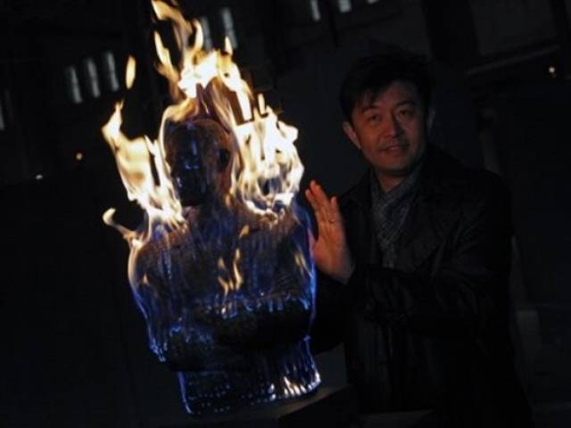 A sculpture by Chinese artist Liu Bolin titled "Burning Man Obama". Photo Credit: AP