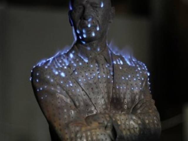 A sculpture by Chinese artist Liu Bolin titled "Burning Man Obama". Photo Credit: AP