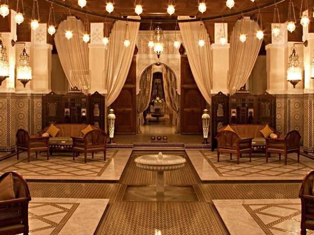 Built into the ancient wall of Marrakech, the hotel recreates a historical medina of Andalusian courtyards
